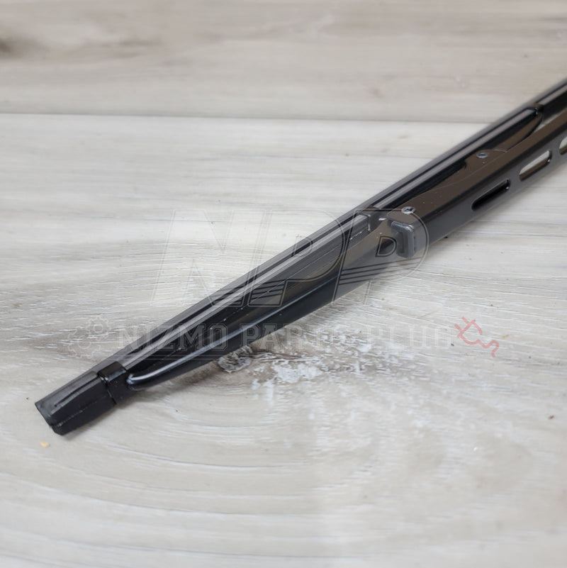 Load image into Gallery viewer, New black Pitwork rear wiper blade assembly for Nissan R34 Skyline, shown on a wood-grain surface.
