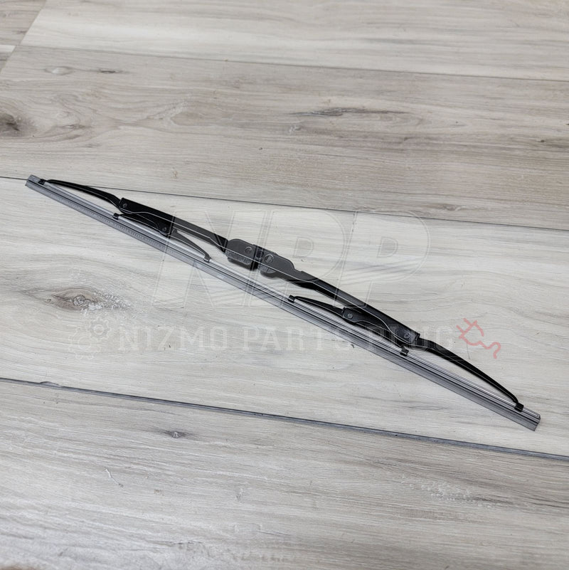 Load image into Gallery viewer, New black Pitwork rear wiper blade assembly for Nissan R34 Skyline, positioned diagonally on a wood-grain surface.