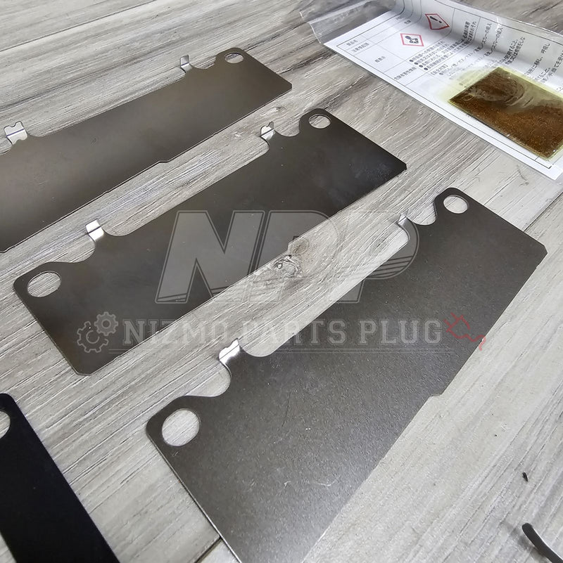 Load image into Gallery viewer, Nissan OEM Front Brake Disk Pad Hardware Kit (R33 GTS/R34 GTT) - NizmoPartsPlug