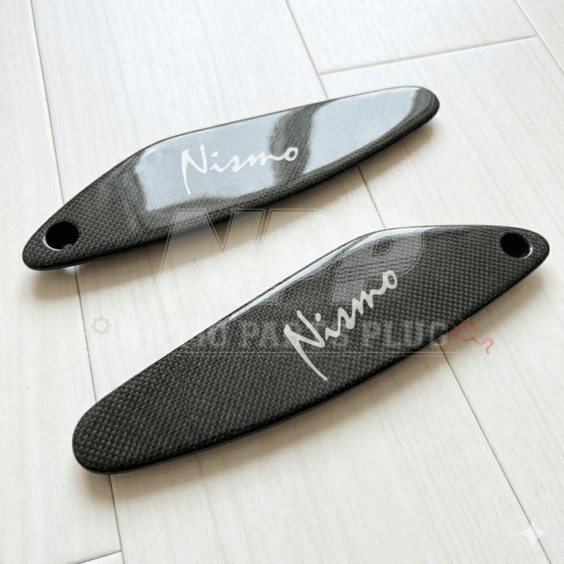 Load image into Gallery viewer, Glossy carbon fiber R33 GTR Nismo rear spoiler mid covers with white logo detailing.