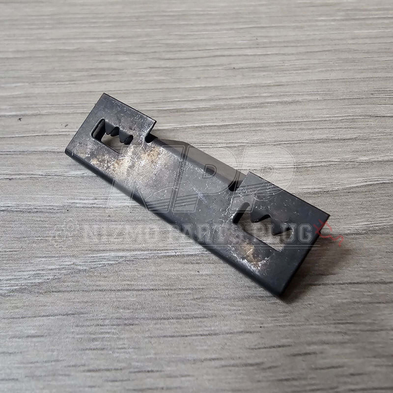 Load image into Gallery viewer, Nissan R32 Skyline GT-R Front Bumper Lower Grill Mounting Pressure Clip on a wooden surface