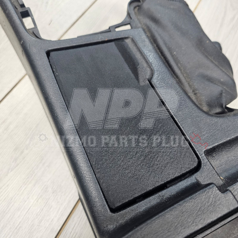 Load image into Gallery viewer, Black interior cup holder cover for Nissan R34 Skyline, featuring a textured finish and good condition.