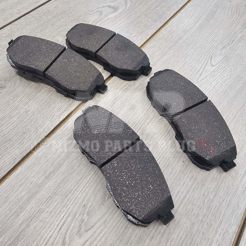 Load image into Gallery viewer, New OEM front brake pad set for Nissan S15 Silvia, featuring a textured black finish on a wooden background.