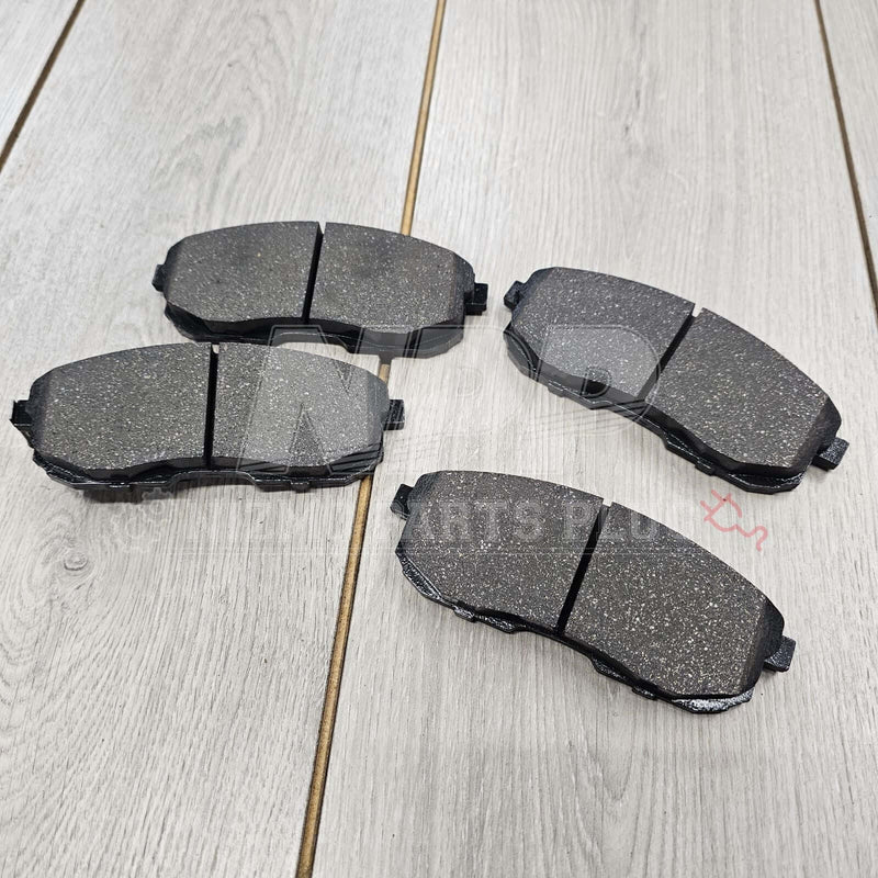 Load image into Gallery viewer, OEM front brake pad set for Nissan S15 Silvia, featuring black textured friction material in new condition.
