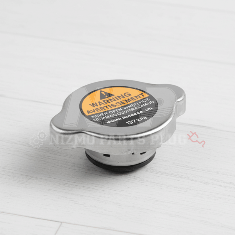 Load image into Gallery viewer, Silver Nissan OEM 137 kPa radiator coolant cap with yellow warning label, suitable for S13, S14, R32, R33, R34.