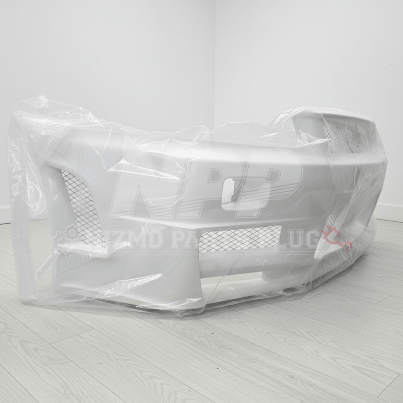 Load image into Gallery viewer, New, unpainted white Nissan R34 Skyline GTR Nismo Z-Tune front bumper assembly, wrapped in protective plastic.
