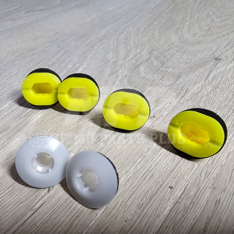Load image into Gallery viewer, New Nissan R34 Skyline exterior B-pillar clip set with four neon yellow and two white plastic clips on wood background.