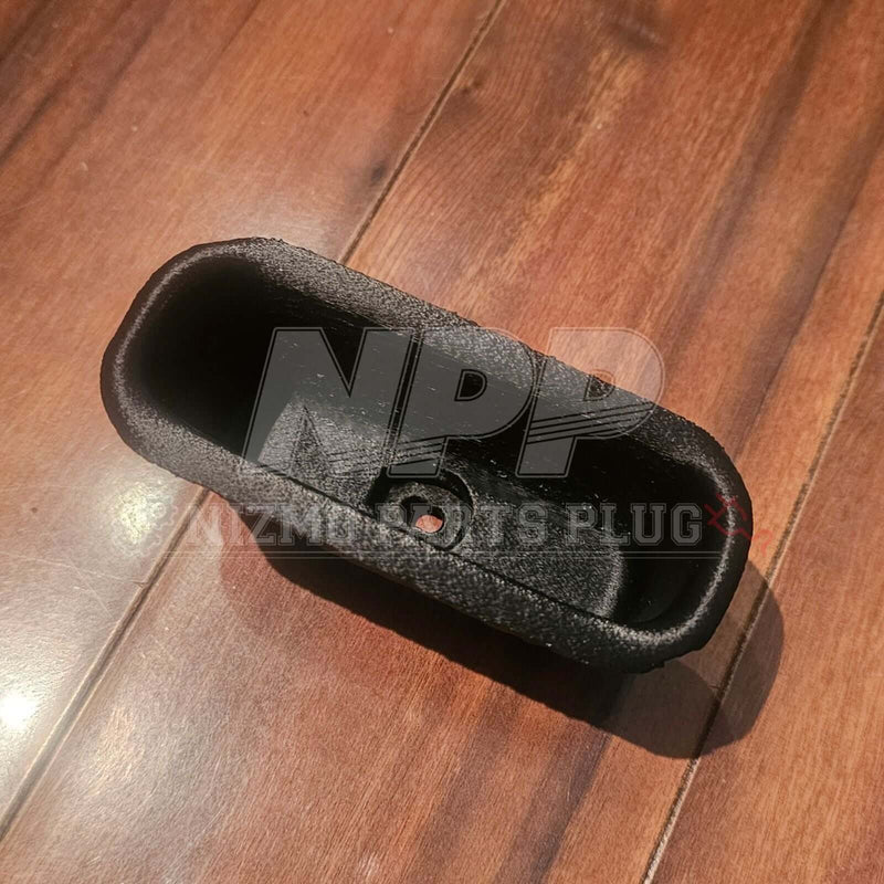 Load image into Gallery viewer, Black textured reproduction door pocket for R32 Skyline coupe, shown from a top-down view on a wooden floor.