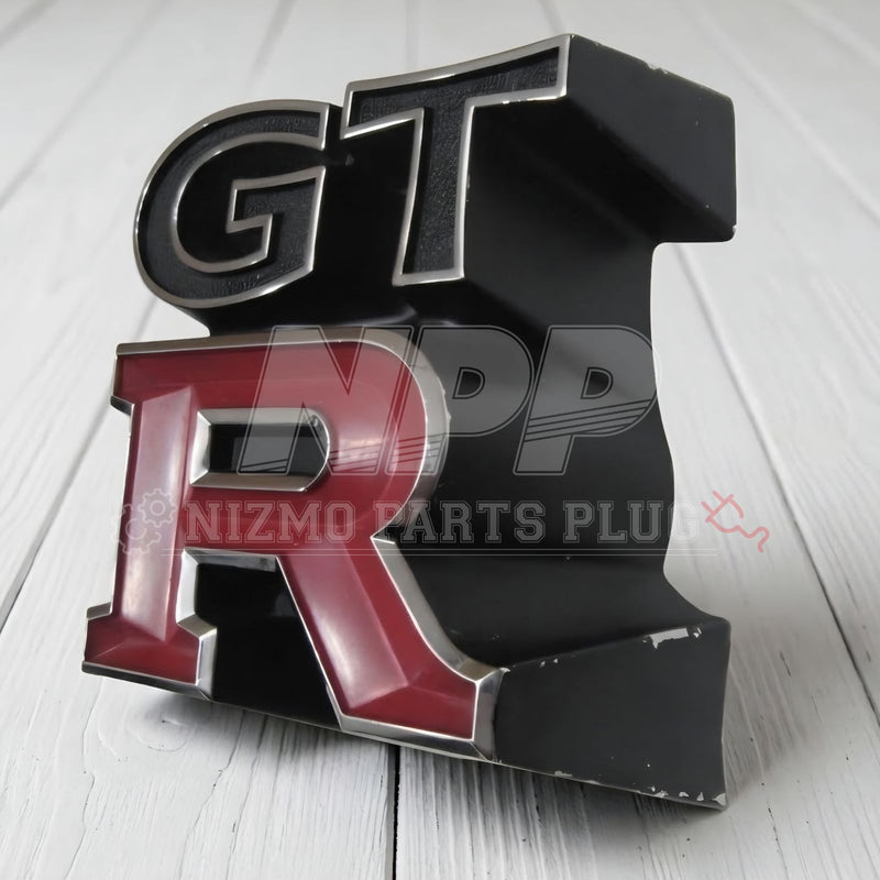 Load image into Gallery viewer, Rare OEM Used Nissan Skyline GT-R (KPGC110) "Kenmeri" Front Grille Emblem – 62319-R4800