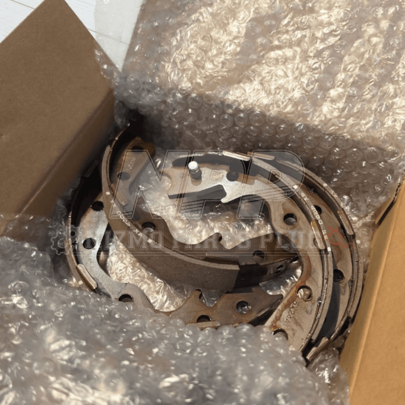 Load image into Gallery viewer, New Pitwork rear brake shoe set for Nissan Skyline R32, R33, and R34 GT-R inside a bubble-wrapped cardboard box.