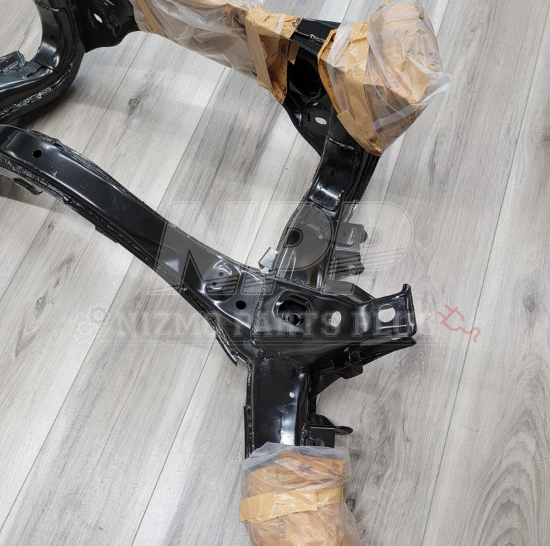 Load image into Gallery viewer, Black rear subframe assembly for Nissan R34 Skyline GTR, clean condition with plastic-wrapped mounting points.