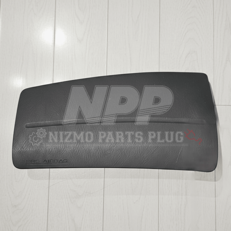 Load image into Gallery viewer, Black Nissan R34 Skyline passenger SRS airbag assembly in good condition, featuring textured finish and SRS branding.