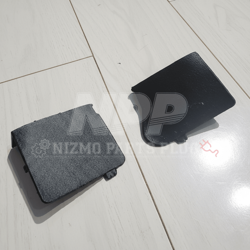 Load image into Gallery viewer, Black Mirai Mamoru steering wheel access cover set for Nissan R34 Skyline and S15 Silvia on a light wood floor.