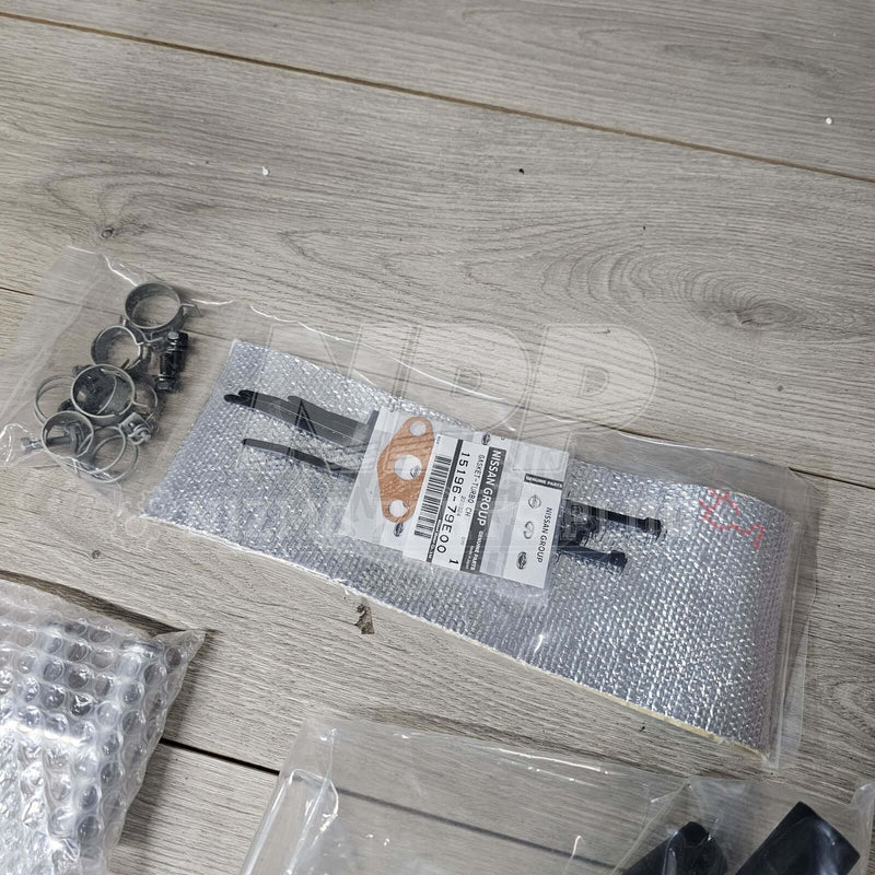Load image into Gallery viewer, New Nismo oil separator kit for R33/R34 GT-R RB26DETT. Includes silver heat shielding, clamps, and Nissan gaskets.