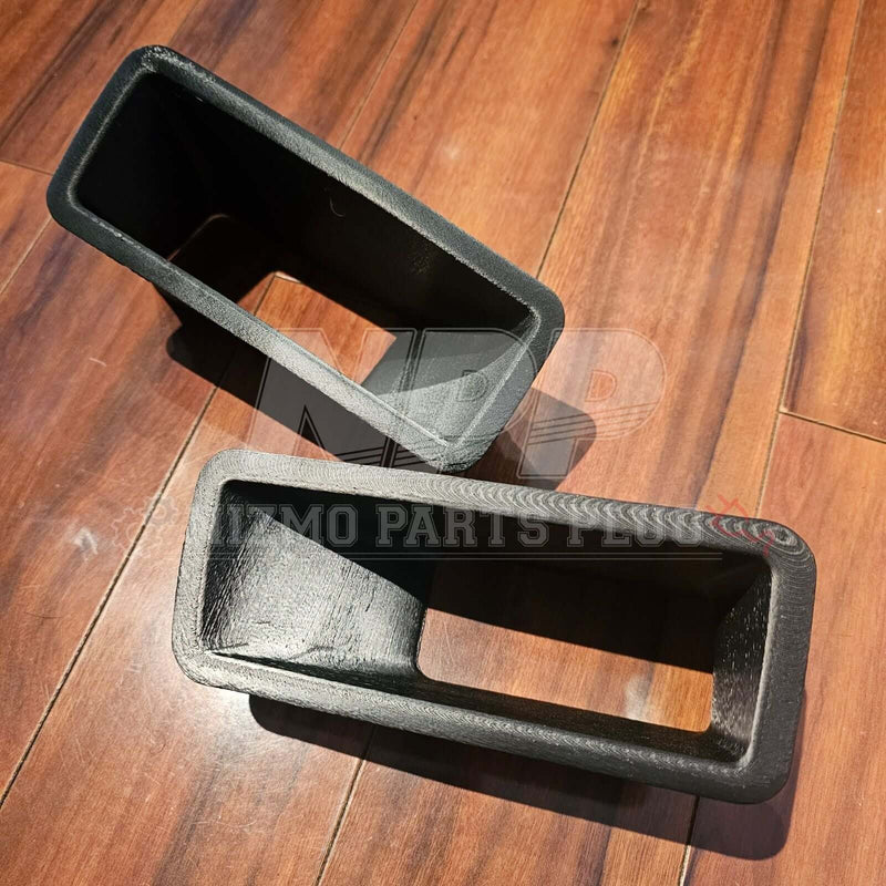 Load image into Gallery viewer, Mīrai Mamōru Reproduction R32 GTR N1 Style Front Air Duct (RH + LH Set) shown from above on wooden floor.