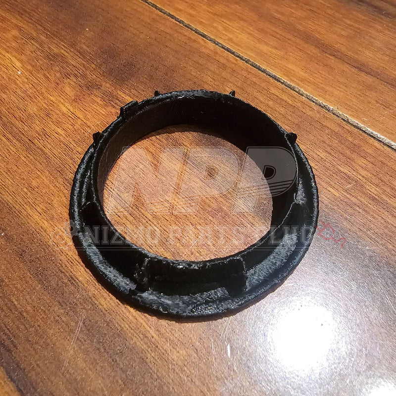 Load image into Gallery viewer, Black 3D-printed ignition ring cover for Nissan R34 Skyline, shown on a wood surface.