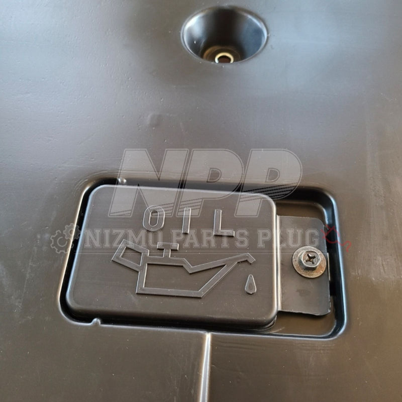 Load image into Gallery viewer, Black front lower engine cover for R34 Skyline GTR Vspec, featuring a small removable access panel with oil logo.