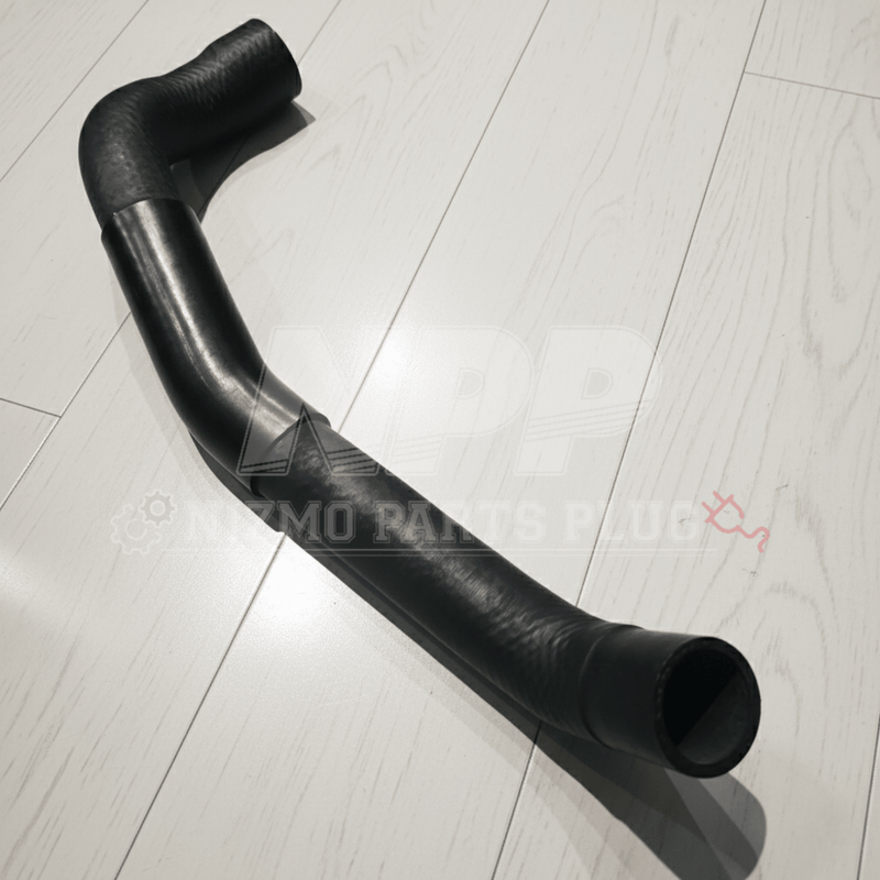 Load image into Gallery viewer, Black rubber lower radiator coolant hose for Nissan R34 Skyline GTR on a white wood background.