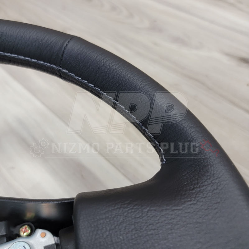 Load image into Gallery viewer, Nissan R34 Skyline GTR V-Spec Steering Wheel Assembly - NizmoPartsPlug