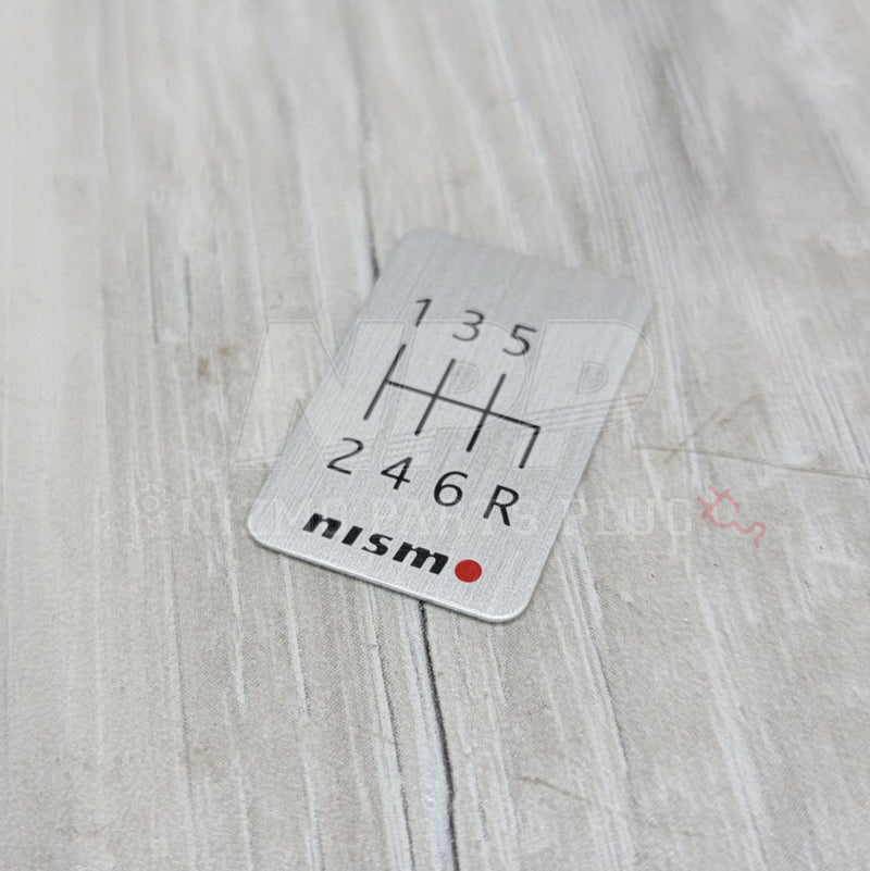 Load image into Gallery viewer, Nismo 6-Speed Manual Shift Pattern Brushed Emblem - NizmoPartsPlug