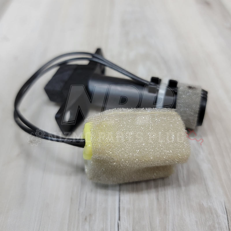 Load image into Gallery viewer, Nissan R32 Skyline A/C in-car temperature sensor with black housing and foam filter attachment.
