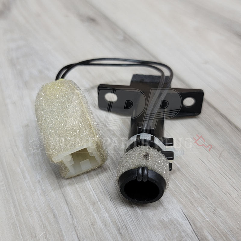 Load image into Gallery viewer, Nissan R32 Skyline A/C in-car temperature sensor with black plastic housing and original foam insulation.