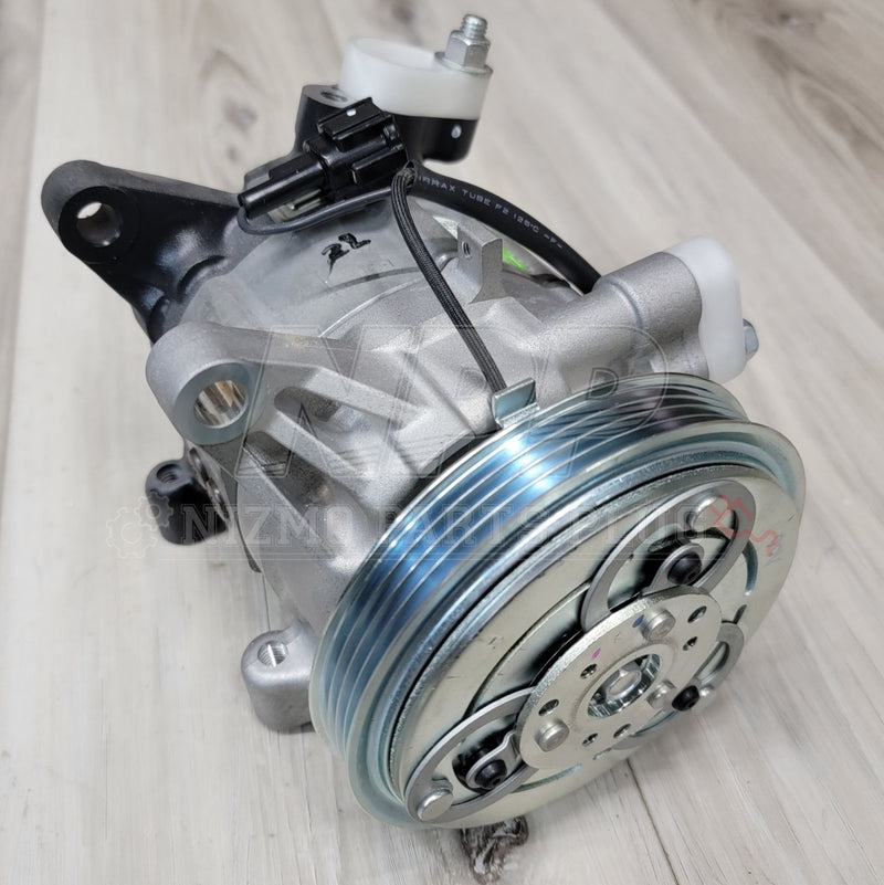 Load image into Gallery viewer, Nissan R34 Skyline GT-R AC Compressor Assembly - NizmoPartsPlug