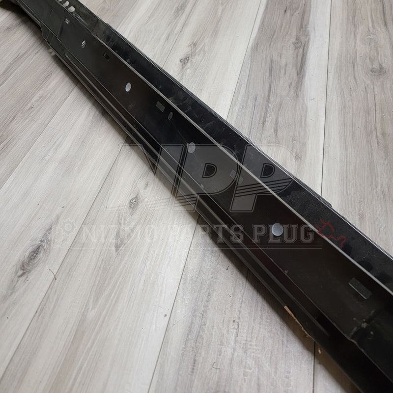 ギャラリービューアに画像をロードする, Black lower rocker metal panel for Nissan S13 240SX, clean condition, on a wood-look surface.