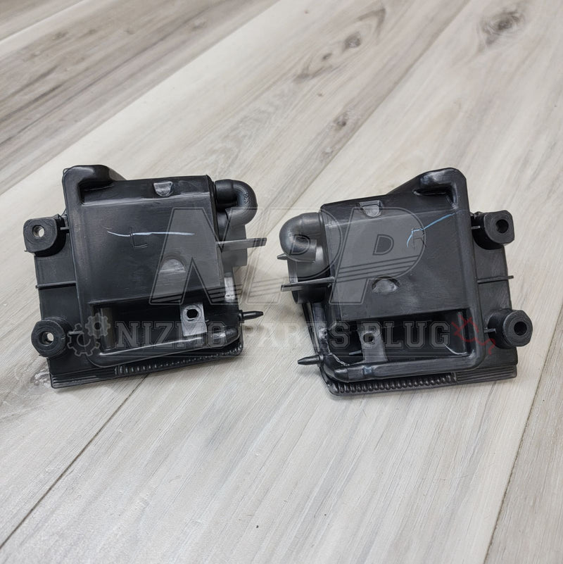 Load image into Gallery viewer, Nissan R32 Skyline coupe reverse light assembly set, black plastic housing, viewed from the back.