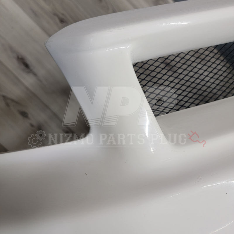Load image into Gallery viewer, White Nissan R34 Skyline GTR Nismo S-Tune front bumper with black mesh grille.