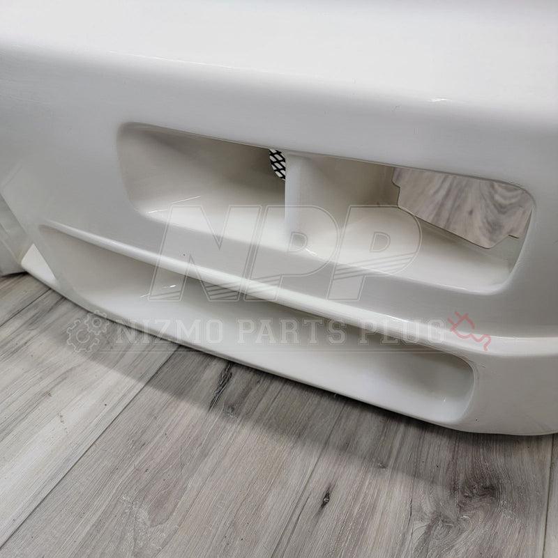 Load image into Gallery viewer, White Nismo S-Tune front bumper for Nissan R34 Skyline GTR with air duct vents, in good condition.