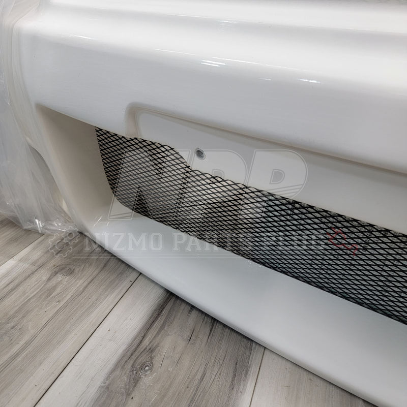 Load image into Gallery viewer, White Nismo S-Tune front bumper for Nissan R34 Skyline GTR, features black mesh grille insert.
