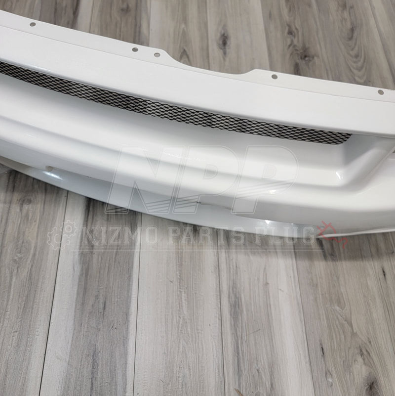 Load image into Gallery viewer, White Nismo S-Tune front bumper for Nissan R34 Skyline GT-R with mesh grille insert.