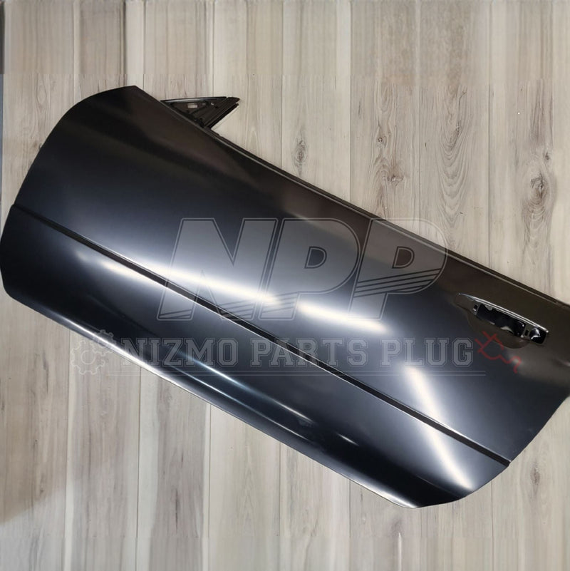 Load image into Gallery viewer, Nissan R34 Skyline Coupe Front Door Assembly LH - NizmoPartsPlug
