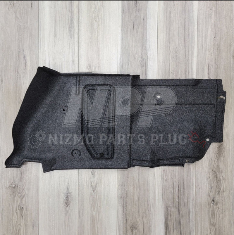 Load image into Gallery viewer, Black left-hand trunk wheel housing interior finisher for Nissan R34 GTR, showing clean carpeted trim.