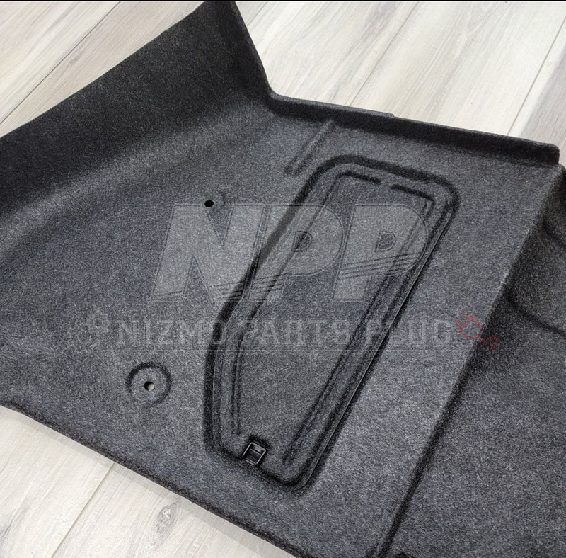 Load image into Gallery viewer, Black R34 GTR left-hand trunk wheel housing interior trim piece in clean, excellent condition.