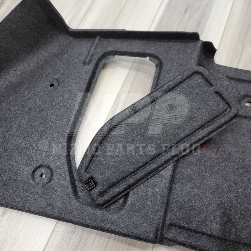 Load image into Gallery viewer, R34 GTR left-hand trunk wheel housing interior trim in dark grey felt, showing the main panel and matching cover.