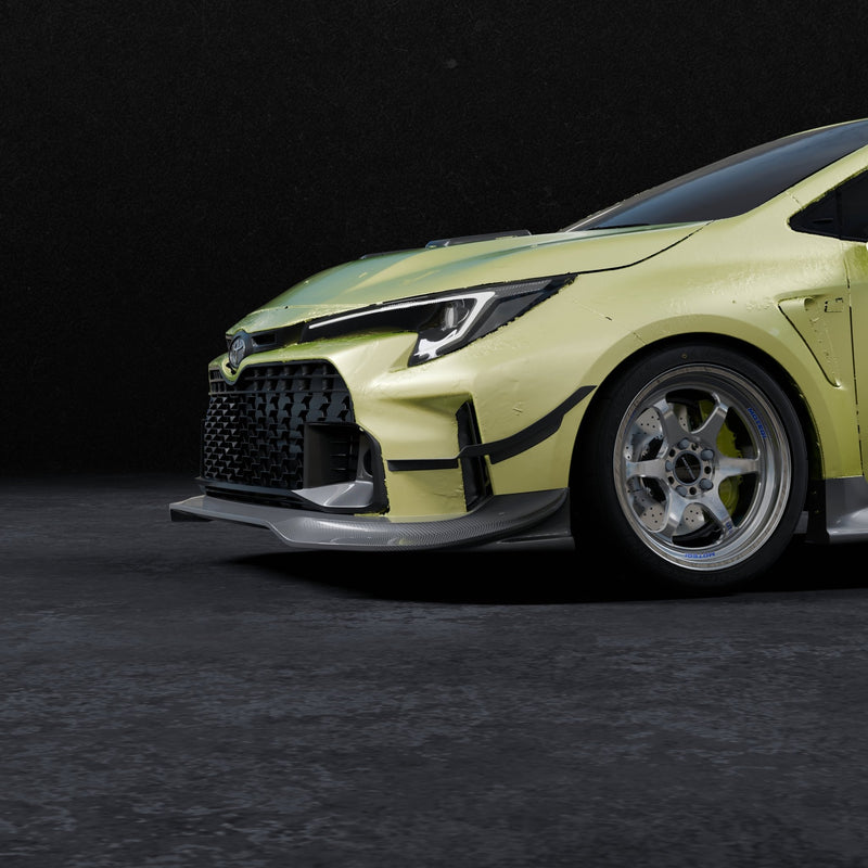 Load image into Gallery viewer, Carbon fiber V2 front lip on a yellow Toyota GR Corolla (E210) against a dark background.