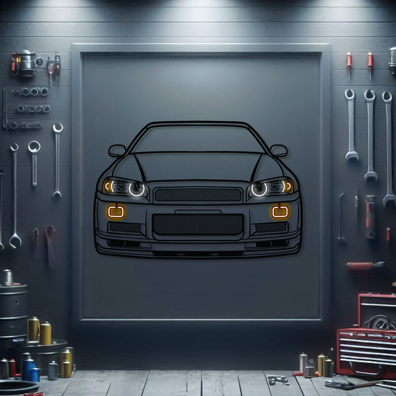 Load image into Gallery viewer, Black metal GT-R R34 front view wall art with glowing LED headlights and turn signals on a dark garage background.