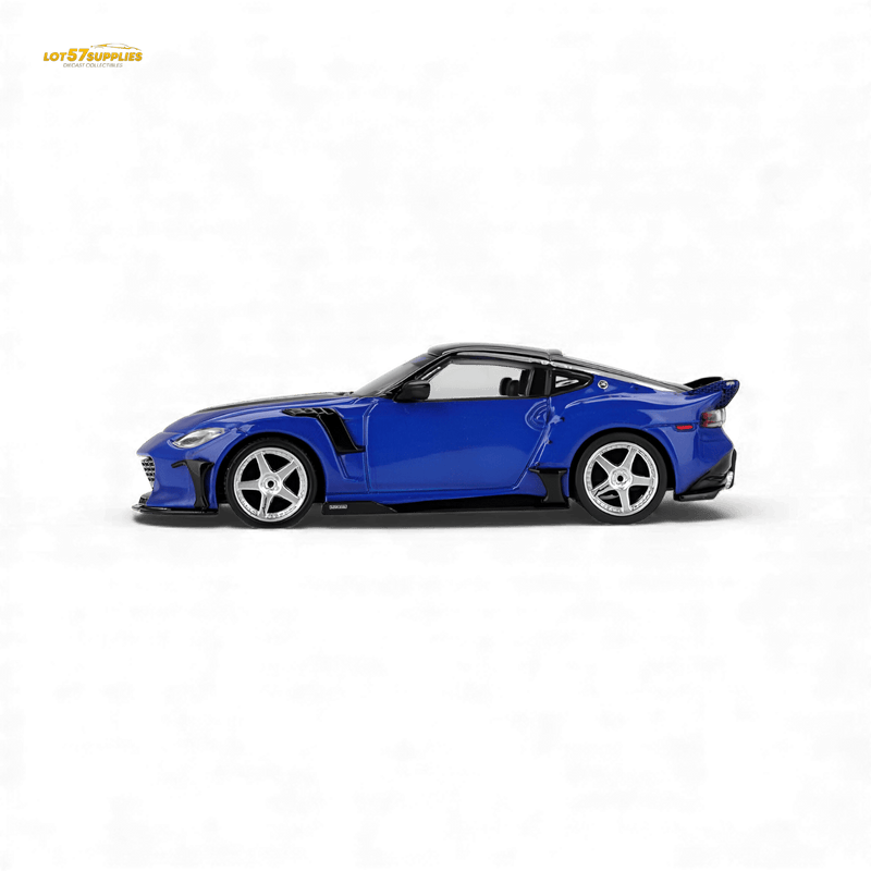 Load image into Gallery viewer, Mini GT 1:64 scale Nissan Z VeilSide FFZ400 in Seiran Blue with a custom body kit and silver 5-spoke wheels.