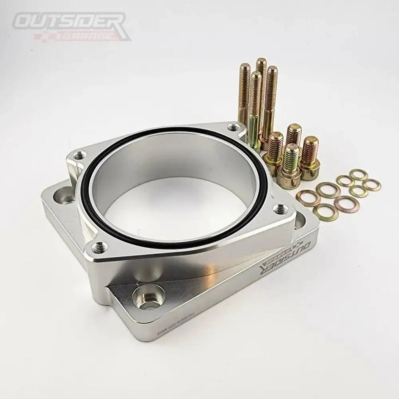 ギャラリービューアに画像をロードする, Silver billet aluminum Q45 to Nissan Maxima DBW throttle body adapter kit with included gold hardware and O-ring.