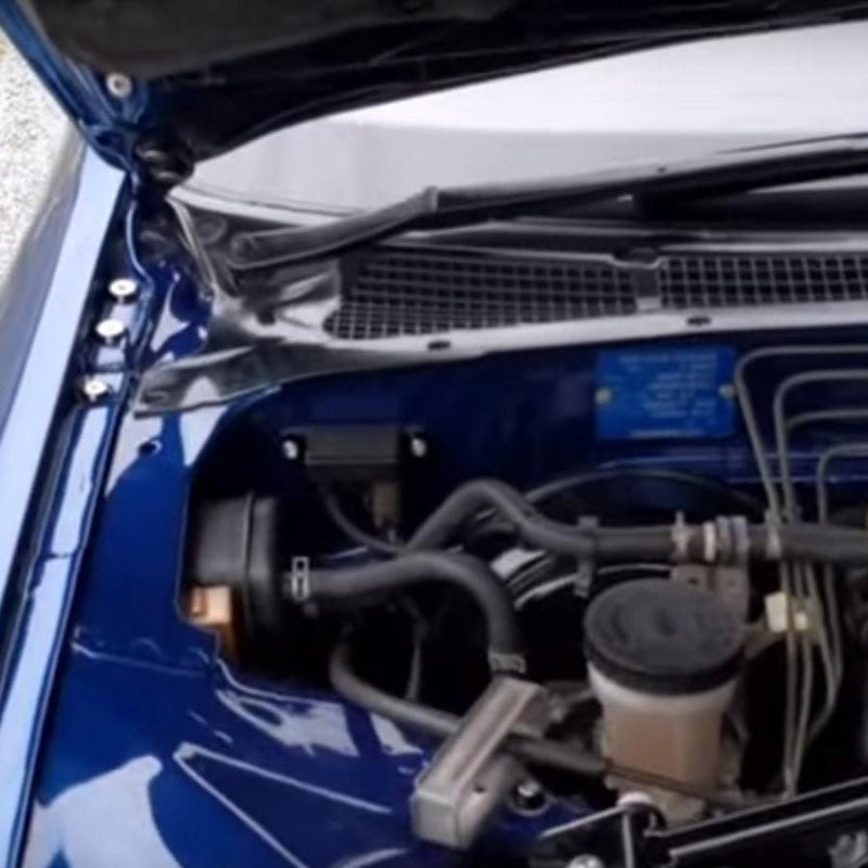 Cargue la imagen en el visor de la galería, ZSPEC Stage-3 silver stainless bolt kit installed in a blue Nissan Skyline R32/R33/R34 engine bay.