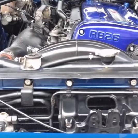 Cargue la imagen en el visor de la galería, ZSPEC stainless bolt kit installed on a Nissan Skyline GT-R R32/R33/R34 engine bay with a blue RB26 valve cover.