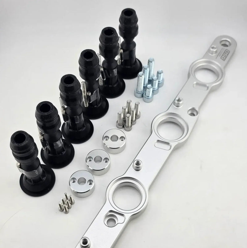 Load image into Gallery viewer, Nissan RB DOHC R35 ignition coil conversion kit with silver mounting bracket, six black coils, and hardware.