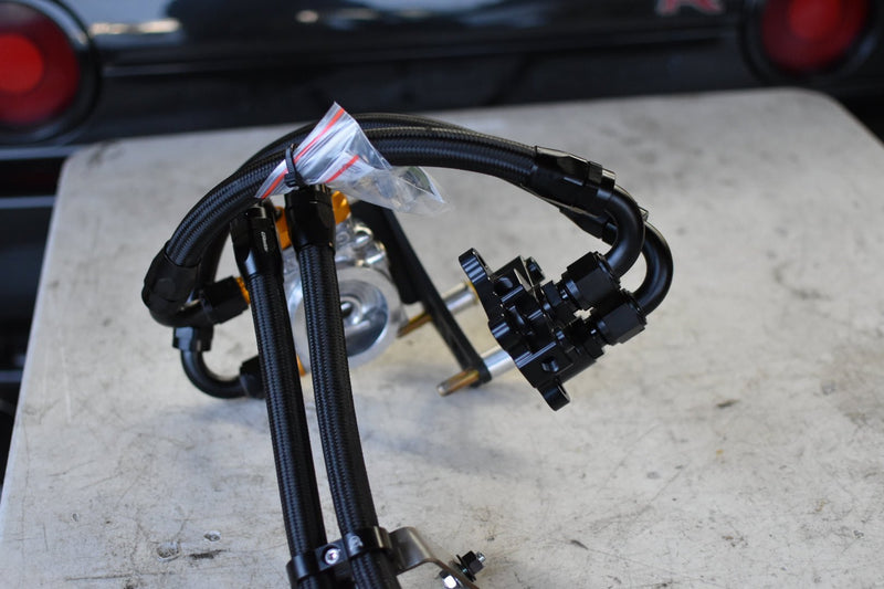 Load image into Gallery viewer, U.P.G. oil cooler lines and fittings for R32 GTR, featuring black braided hoses and silver/black hardware.
