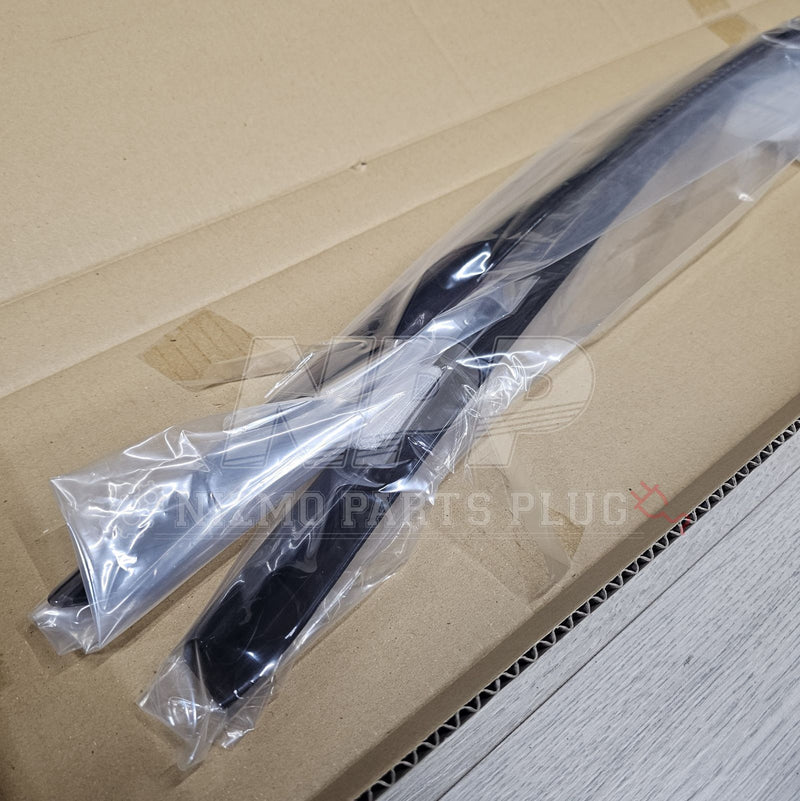 Load image into Gallery viewer, New black optional JDM rainguards for Nissan R34 Skyline coupe, sealed in plastic packaging.