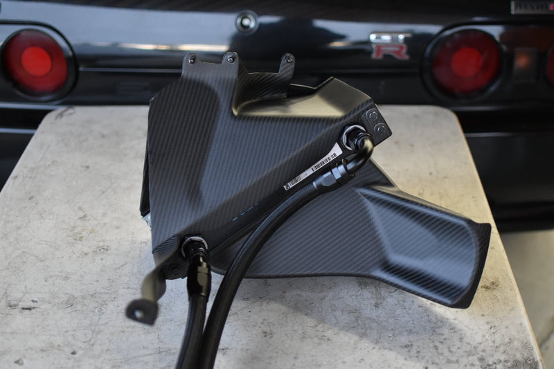 Load image into Gallery viewer, Complete U.P.G. oil cooler with black carbon fiber ducting for Nissan R32 GTR, shown with braided hoses.