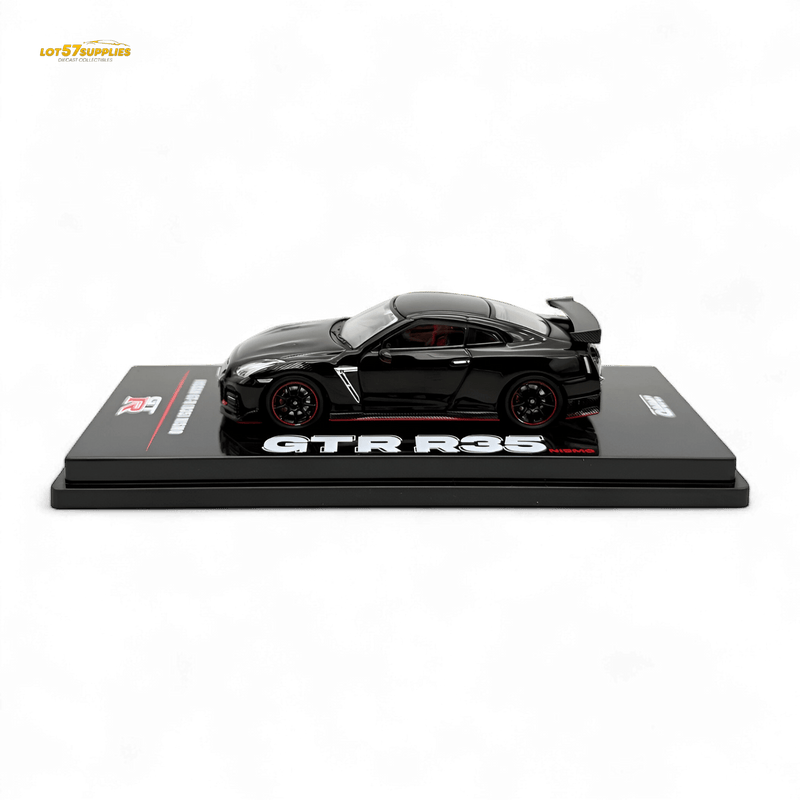 Load image into Gallery viewer, Inno64 1:64 scale black Nissan GT-R R35 NISMO diecast model on a display stand with red rim accents.