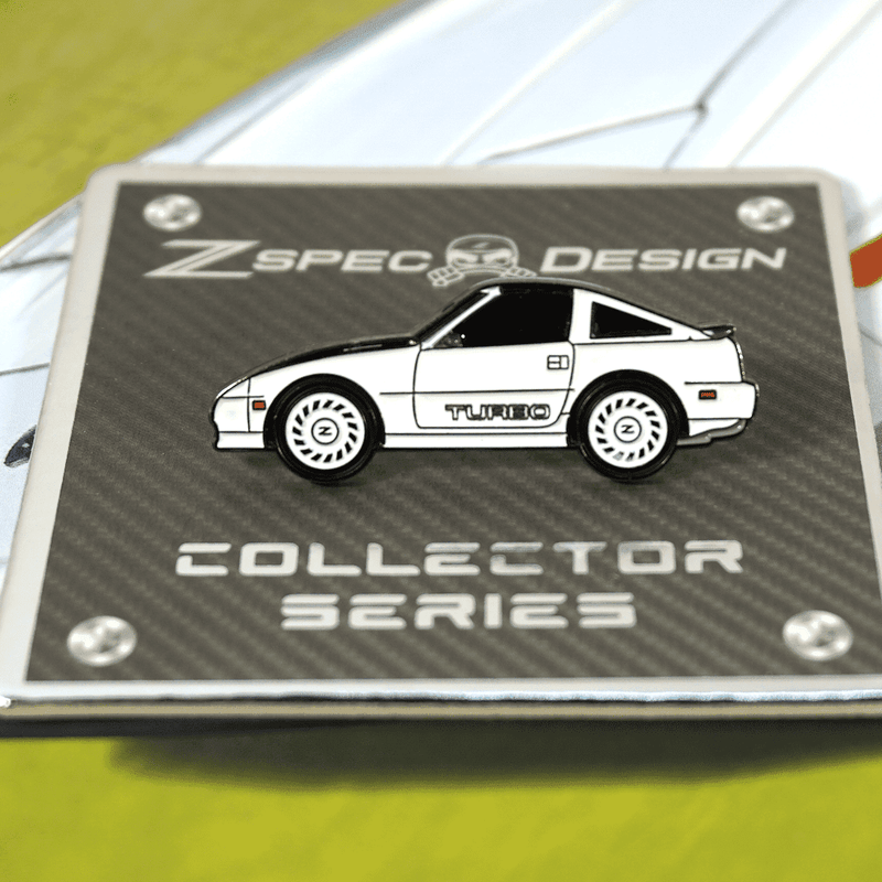 Load image into Gallery viewer, ZSPEC white Nissan 300ZX Z31 Shiro edition hat pin featuring a side-profile turbo model on a collector display card.
