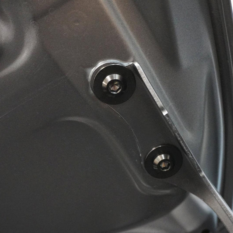 Load image into Gallery viewer, ZSPEC titanium hood fastener kit installed on a Toyota GR Corolla, featuring two metallic hardware bolts.